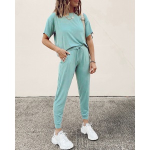 Costume décontracté à manches courtes pour femme avec col rond et de couleur unie