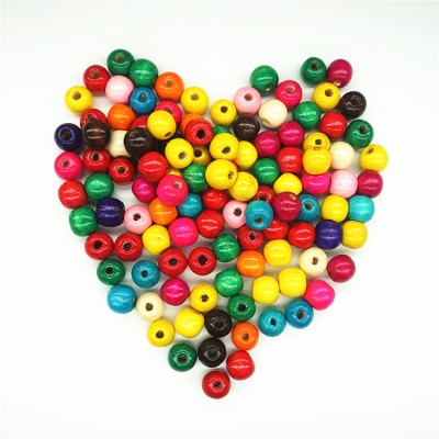 Perles en bois colorées pour confection de bracelets  pour enfants