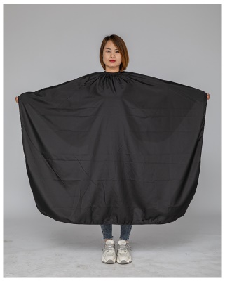 Tablier de protection pour salon de coiffure