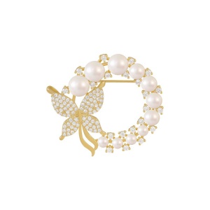 Broche circulaire dorée de perles